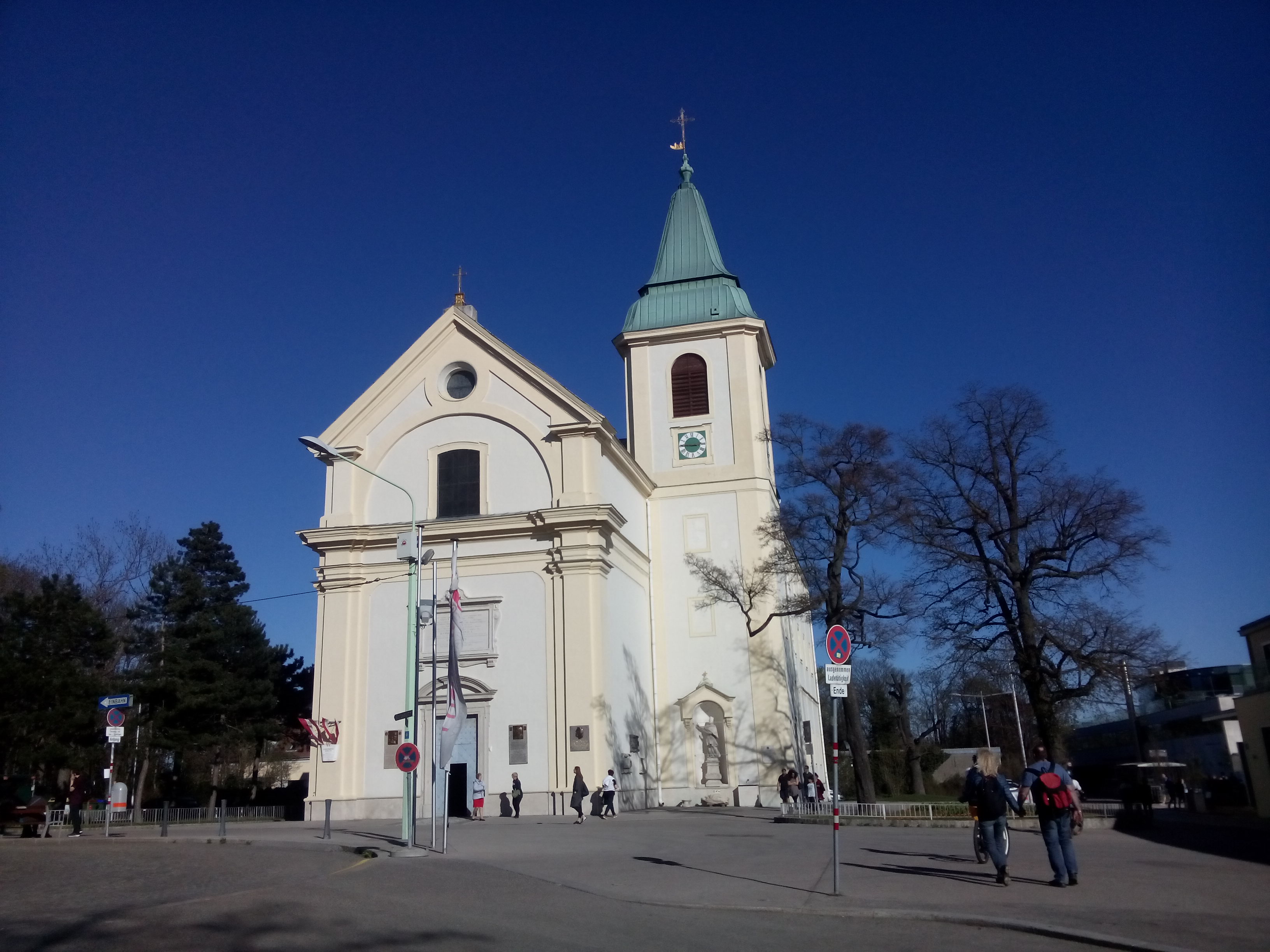 A white church against a stark blue sky