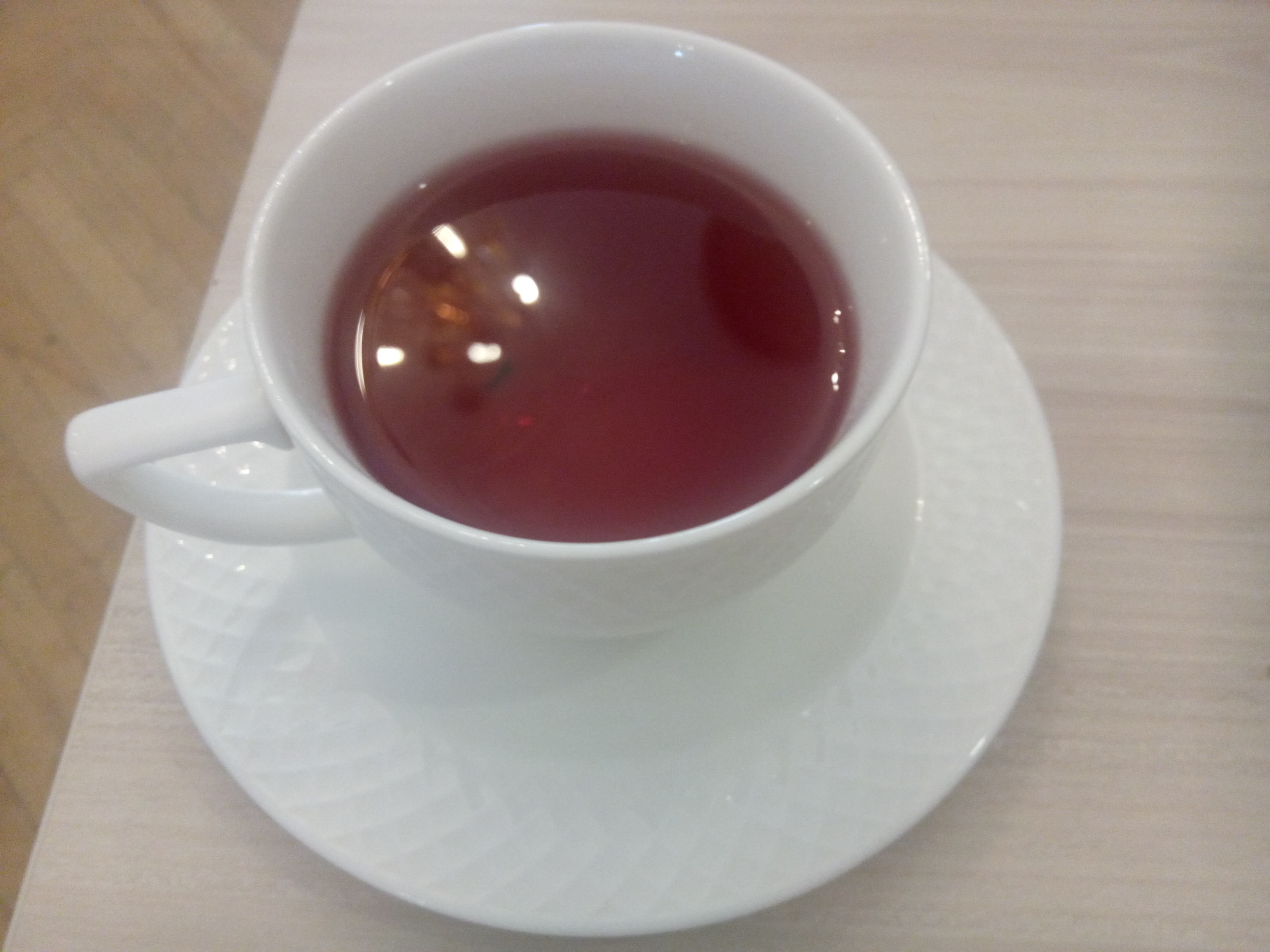 A white cup with purple tea