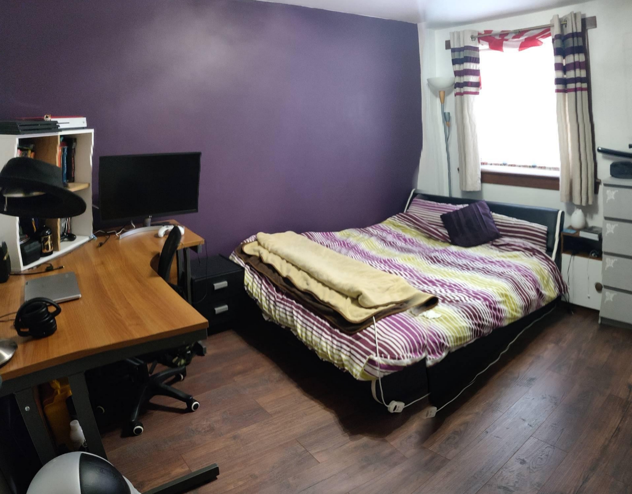 After: Bedroom with dark purple wall, teak laminate floor, dark wood desk